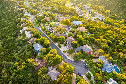 Established tree-lined suburban neighborhood like Block House Creek in Leander, Texas