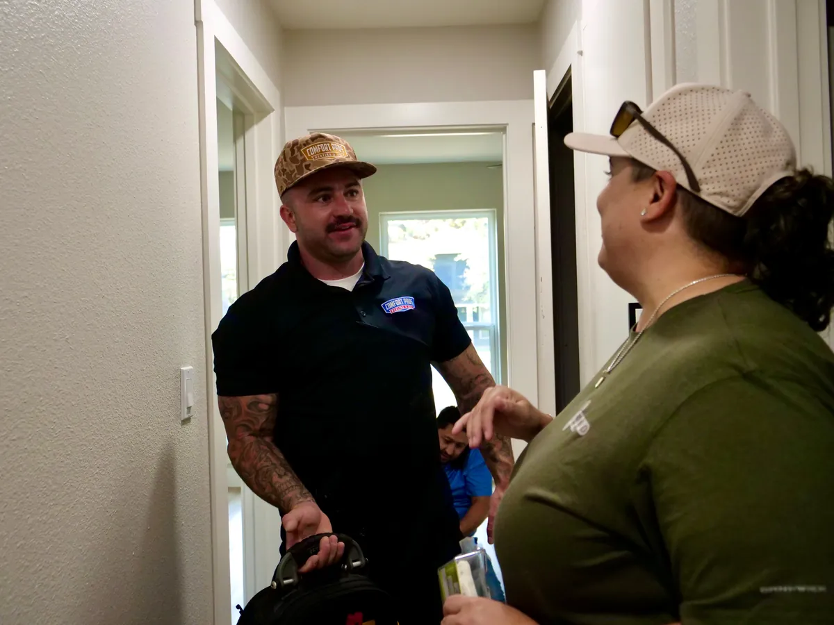 Comfort Pros technician at work on a local home