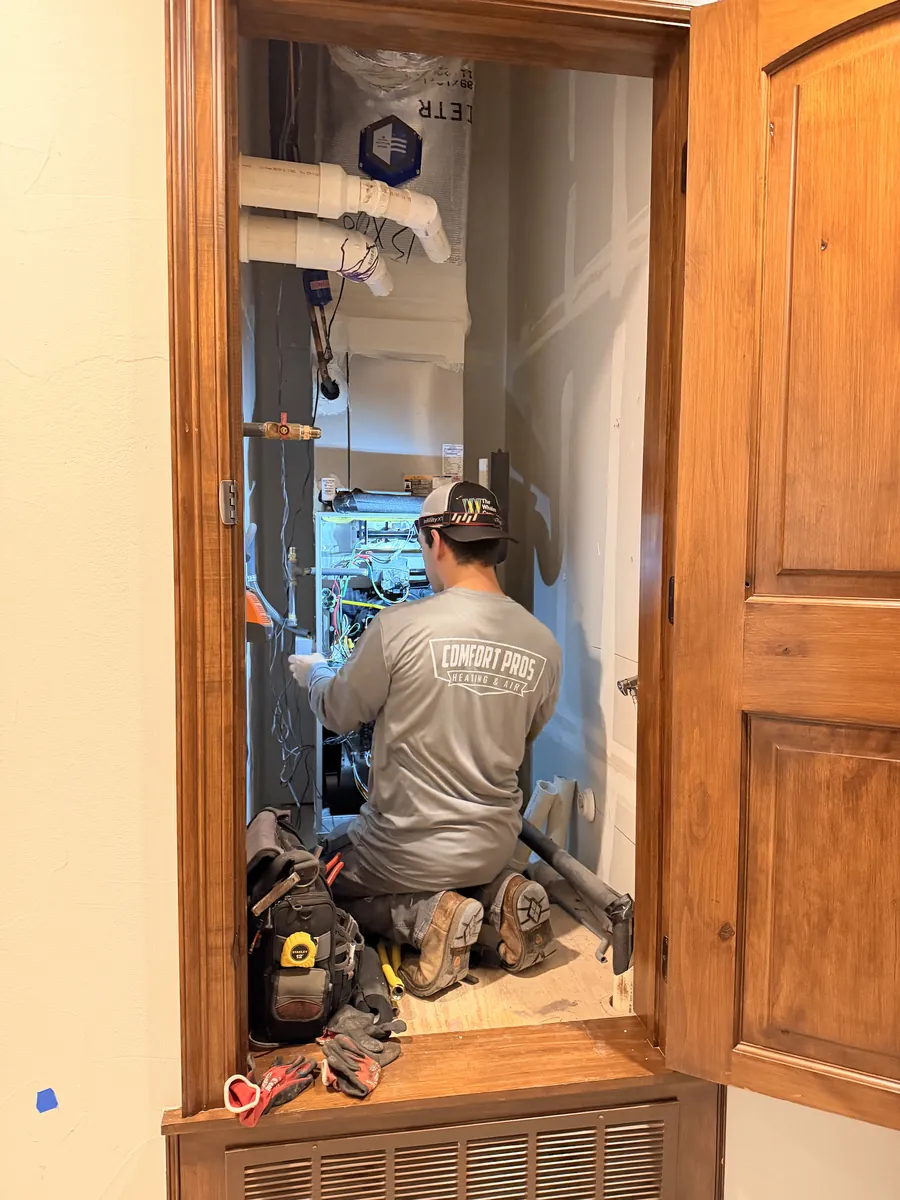 HVAC technician performing a diagnostic service call
