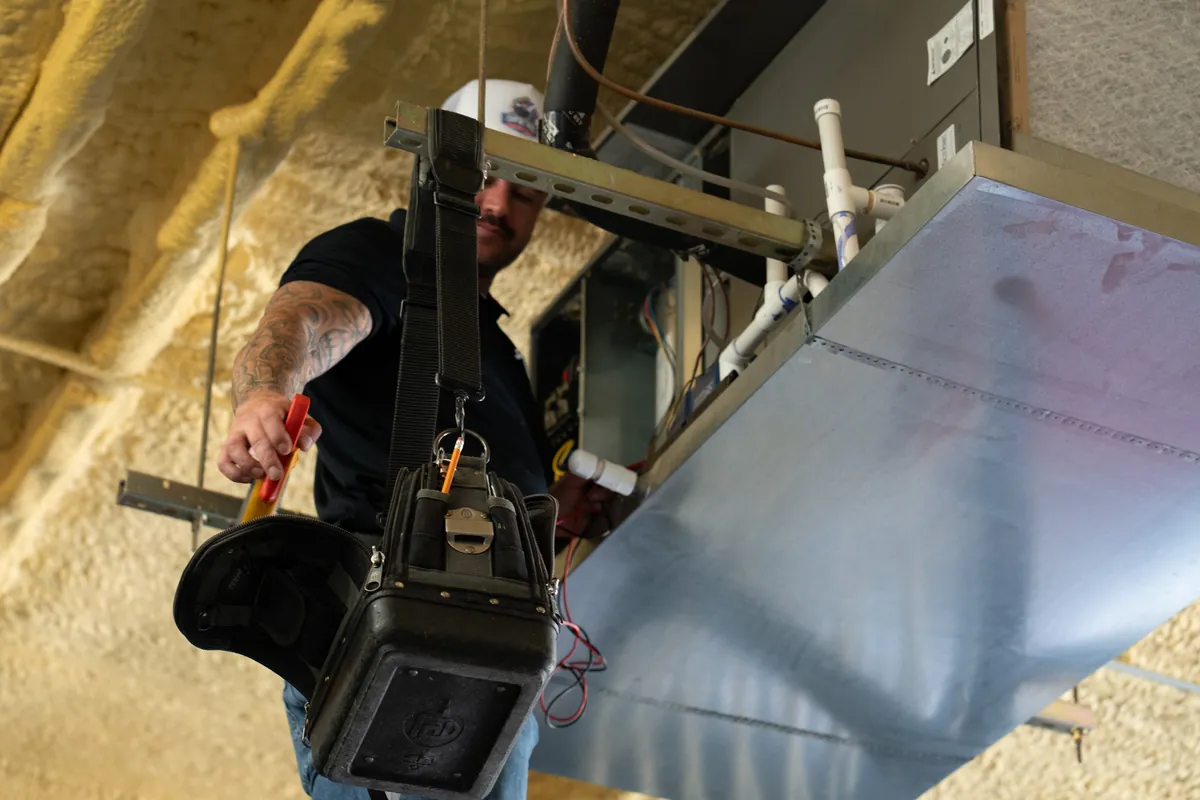 Clean residential furnace installation in a Leander home utility room