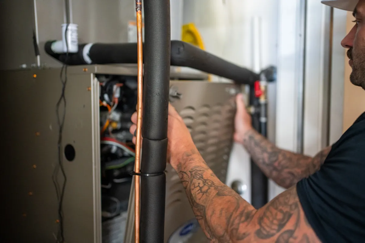 Refrigerant lines on a new Carrier system installation in Leander, Texas