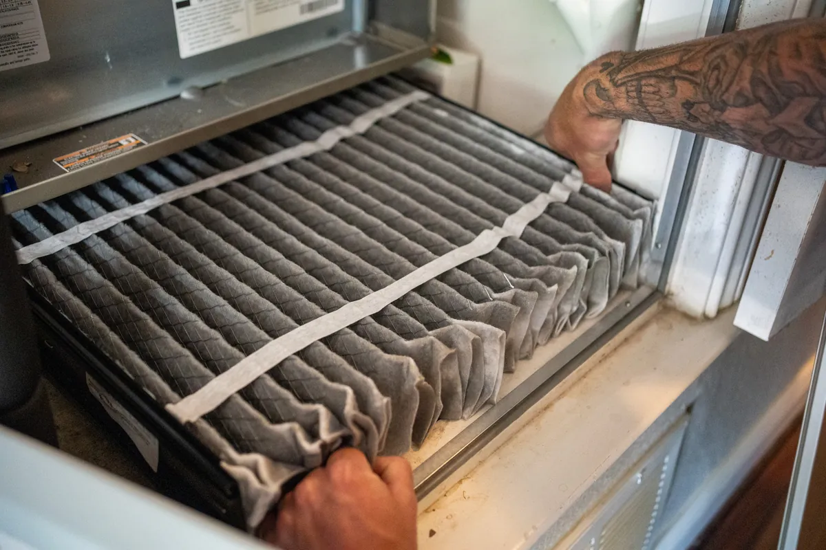Detail of HVAC technician work on an installed system